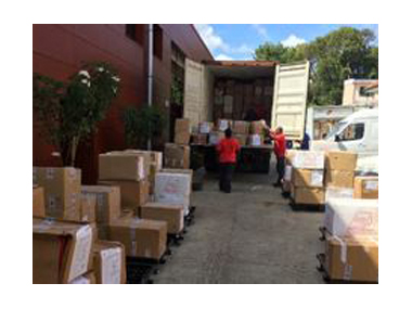 Movers loading a truck with boxes